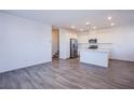 Spacious living room features an open concept and flows into a bright kitchen at 145 Aqua Commons Ln, Henderson, NV 89015