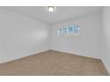 Bright and airy bedroom with neutral carpet, white walls, and ample natural light at 2058 Citroen St, Las Vegas, NV 89142