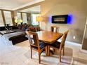 Charming living area boasting a dining table, plush seating, and a sleek fireplace for cozy evenings at 210 E Flamingo Rd # 215, Las Vegas, NV 89169