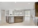Bright kitchen features stainless steel appliances and a spacious center island at 2433 Cingoli St, Henderson, NV 89044