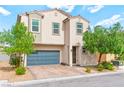 Inviting two-story home featuring desert landscaping and a two-car garage at 2672 Painted Mist Ct, Las Vegas, NV 89142
