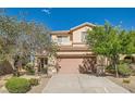 Charming home featuring a two-car garage and drought-tolerant landscaping for easy maintenance at 2728 Holmfault St, Henderson, NV 89044