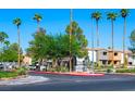 Community entrance with lush landscaping, mature trees, and clear signage in a well maintained neighborhood at 3151 Soaring Gulls Dr # 1023, Las Vegas, NV 89128