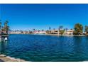 Beautiful lake view featuring waterfront homes, and boats in the distance on a clear, sunny day at 3151 Soaring Gulls Dr # 1023, Las Vegas, NV 89128