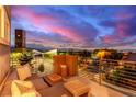 Relaxing outdoor balcony space with comfortable seating and stunning sunset views at 3165 Via Como, Henderson, NV 89044