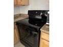 The black oven is positioned next to the marble-look counter at 3930 University Center Dr # 702, Las Vegas, NV 89119