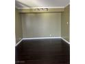 The room is equipped with dark hardwood flooring at 3930 University Center Dr # 702, Las Vegas, NV 89119