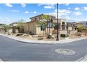 Corner lot showcasing the home's charming landscaping and stone facade at 4140 Coneflower St, Las Vegas, NV 89135