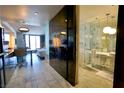 Modern suite featuring a sleek bathroom with marble tiling, glass shower, and contemporary fixtures at 4381 W Flamingo Rd # 3118, Las Vegas, NV 89103