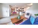 Open living and dining area with a kitchen view, perfect for modern living at 48344 Orchid Ridge Ave # 104, Las Vegas, NV 89141