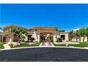 Stately home featuring a grand entrance with manicured landscaping and a circular driveway at 5079 Mountain Top Cir, Las Vegas, NV 89148