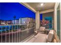 Cozy balcony with seating and potted plants, offering neighborhood views at 6821 Prairie Pearl St, Las Vegas, NV 89148