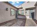 Private courtyard featuring brick flooring and neutral-colored walls at 720 Webber Park St, Henderson, NV 89011