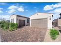 Close-up of a two-car garage and a brick driveway at 720 Webber Park St, Henderson, NV 89011