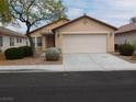 Charming single-story home featuring a two-car garage and well-maintained landscaping in a residential neighborhood at 7924 Pale Rider St, Las Vegas, NV 89131