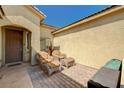 Cozy front patio area with comfortable seating, brick flooring, and a warm, welcoming atmosphere at 8129 Jim Steele Falls St, North Las Vegas, NV 89085