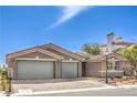 Charming single-story home featuring a two-car garage, desert landscaping, and a well-maintained yard at 8316 Broad Peak Dr, Las Vegas, NV 89131