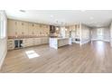 Expansive kitchen with a large island, stainless steel appliances, ample cabinetry, and modern lighting at 8316 Broad Peak Dr, Las Vegas, NV 89131