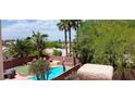 Aerial view of a private pool area with lush greenery and desert landscaping perfect for outdoor relaxation at , Henderson, NV 89052