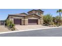 Beautiful two-story home featuring a three-car garage, desert landscaping, and a tile roof at 11088 Westcroft Way, Las Vegas, NV 89183