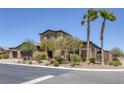 Beautiful two-story home featuring a three-car garage, desert landscaping, and a tile roof at 11088 Westcroft Way, Las Vegas, NV 89183