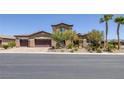 Beautiful two-story home featuring a three-car garage, desert landscaping, and a tile roof at 11088 Westcroft Way, Las Vegas, NV 89183