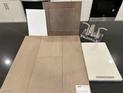 Image showcasing a countertop, flooring, a faucet and cabinet material samples at 124 Silver Run Ln, Las Vegas, NV 89138