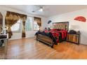 Spacious main bedroom with wood floors, windows, and stylish décor at 1259 Plum Canyon St, Las Vegas, NV 89142