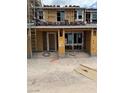 Unfinished exterior elevation with wood framing and stacked roof tiles shows the home's construction process at 136 Silver Run Ln, Las Vegas, NV 89138