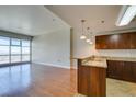 Open concept kitchen with granite countertops, stainless steel sink and city views at 150 Las Vegas Blvd # 2003, Las Vegas, NV 89101