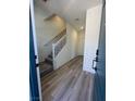 Inviting entryway with hardwood floors and staircase leading to the upper level of the home at 1533 Bat Hawk St, Las Vegas, NV 89144