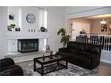 Comfortable living room features a fireplace, area rug, and cozy seating at 1680 Sweet Pea Ave, Las Vegas, NV 89183