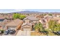 Aerial view of a well maintained home in a neighborhood near the mountains at 2104 Spanish Town Ave, North Las Vegas, NV 89031