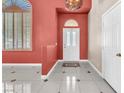 The front entrance is bright and inviting, with tiled floors, arched windows, and a glass front door at 2104 Spanish Town Ave, North Las Vegas, NV 89031