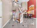 Open-concept entryway featuring staircase to the second level with dining room and chandelier at 2104 Spanish Town Ave, North Las Vegas, NV 89031