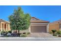 Charming home with a well-maintained yard, inviting curb appeal, and a two-car garage at 248 Windmill Croft Dr, Las Vegas, NV 89148
