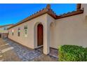 Inviting front entryway with arched columns and a decorative tiled walkway at 248 Windmill Croft Dr, Las Vegas, NV 89148
