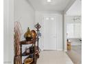 Bright entryway showcases decorative accents and clean tile flooring at 2612 Dearport Ct, Henderson, NV 89052