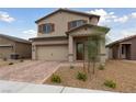 Charming two-story home featuring a two-car garage, complemented by a professionally landscaped front yard at 2729 Pavehawk Way, Las Vegas, NV 89156