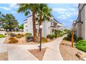 Exterior image displaying the building's design, landscaping, and community appeal at 3150 Soft Breezes Dr # 1216, Las Vegas, NV 89128