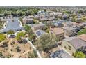 Aerial view of a residential neighborhood with tree-lined streets and well-maintained homes at 3521 Discovery Downs Ct, North Las Vegas, NV 89081
