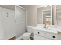 Clean bathroom with a walk-in shower, white fixtures, and a well-lit vanity area at 421 Carlin Ave, Las Vegas, NV 89110