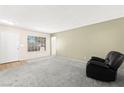 Spacious living room with ample natural light, neutral walls, and comfortable seating arrangement at 421 Carlin Ave, Las Vegas, NV 89110