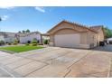 Attractive single story house with a spacious driveway and well maintained landscape at 452 Waterwheel Falls Dr, Henderson, NV 89015
