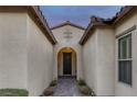 Inviting front entrance featuring a covered walkway and decorative details, creating a warm and welcoming ambiance at 6333 Orto Vaso Ave, Las Vegas, NV 89131