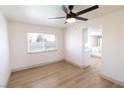 Bright dining room features hardwood floors and a modern ceiling fan at 637 Otono Dr, Boulder City, NV 89005
