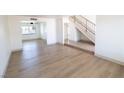Bright, open living space with hardwood floors and a staircase to the second level at 637 Otono Dr, Boulder City, NV 89005