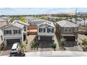 Aerial view of a charming home with a two-car garage in a residential neighborhood at 6611 Dove Point Pl, Las Vegas, NV 89130
