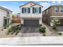 Charming two-story home featuring a two-car garage and attractive exterior at 6611 Dove Point Pl, Las Vegas, NV 89130
