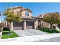 Charming two-story home featuring a tile roof, well-maintained landscaping, and a spacious two-car garage at 852 Colina Alta Pl, Las Vegas, NV 89138
